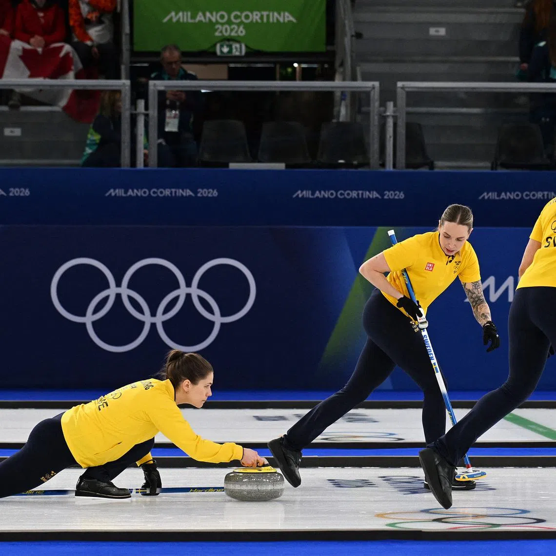 Milano Cortina 2026 Olympics - Curling - Women's Semi-final - Canada vs Sweden - Cortina Curling Olympic Stadium, Cortina d'Ampezzo, Italy - February 20, 2026. Anna Hasselborg of Sweden, Sofia Scharback of Sweden and Agnes Knochenhauer of Sweden in action during the match against Canada REUTERS/Jennifer Lorenzini