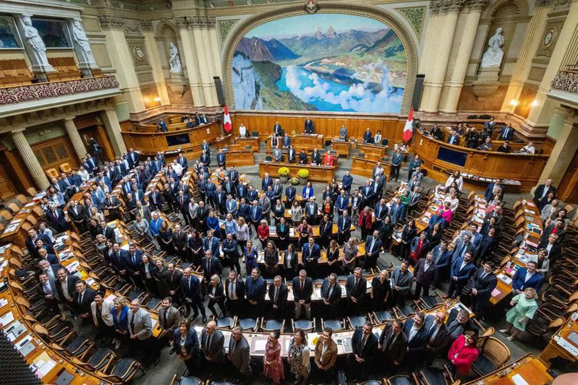 FILE PHOTO: Members of the National Council pose for a group picture on the last day of the legislature before national elections in October at the Swiss Parliament Building (Bundeshaus) in Bern, Switzerland September 29, 2023. REUTERS/Denis Balibouse/File Photo
