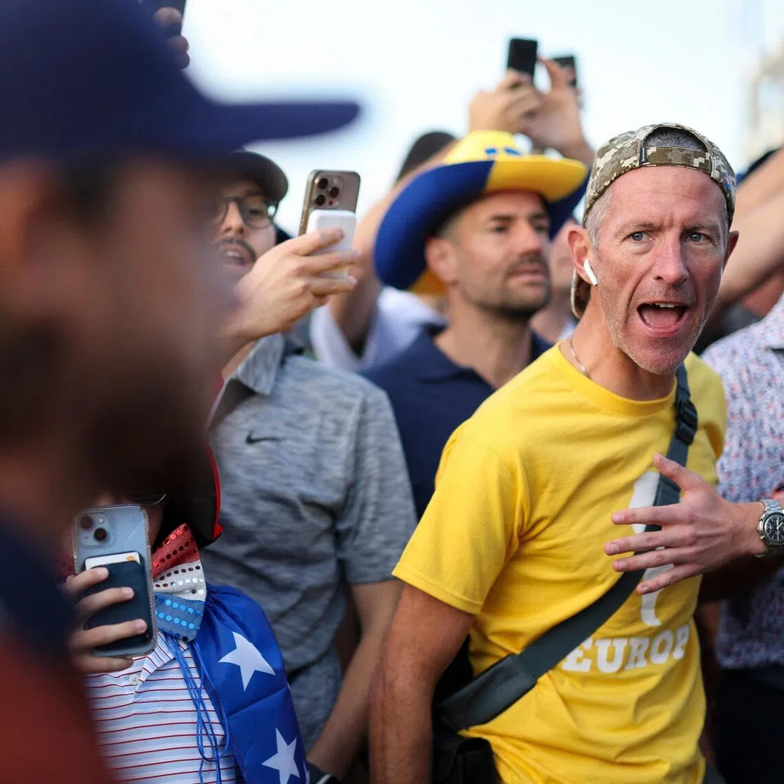 A fan reacting as Tommy Fleetwood of Team Europe walking the first hole during the Sept 27 foursomes matches of the 2025 Ryder Cup at Black Course at Bethpage State Park Golf Course in Farmingdale, New York.   