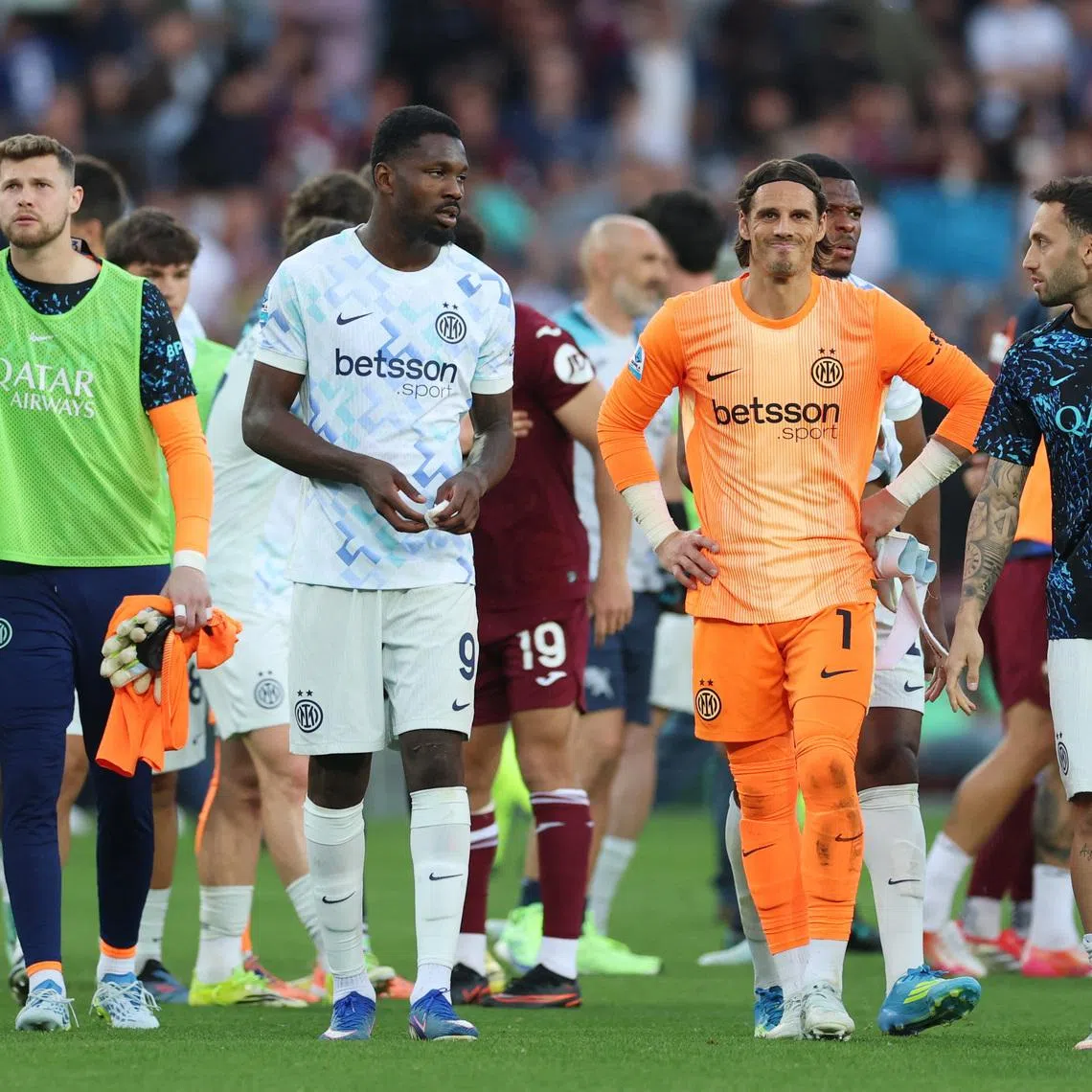 Soccer Football - Serie A - Torino v Inter Milan - Stadio Olimpico Grande Torino, Turin, Italy - April 26, 2026 Inter Milan's Hakan Calhanoglu, Marcus Thuram and Yann Sommer react after the match REUTERS/Claudia Greco