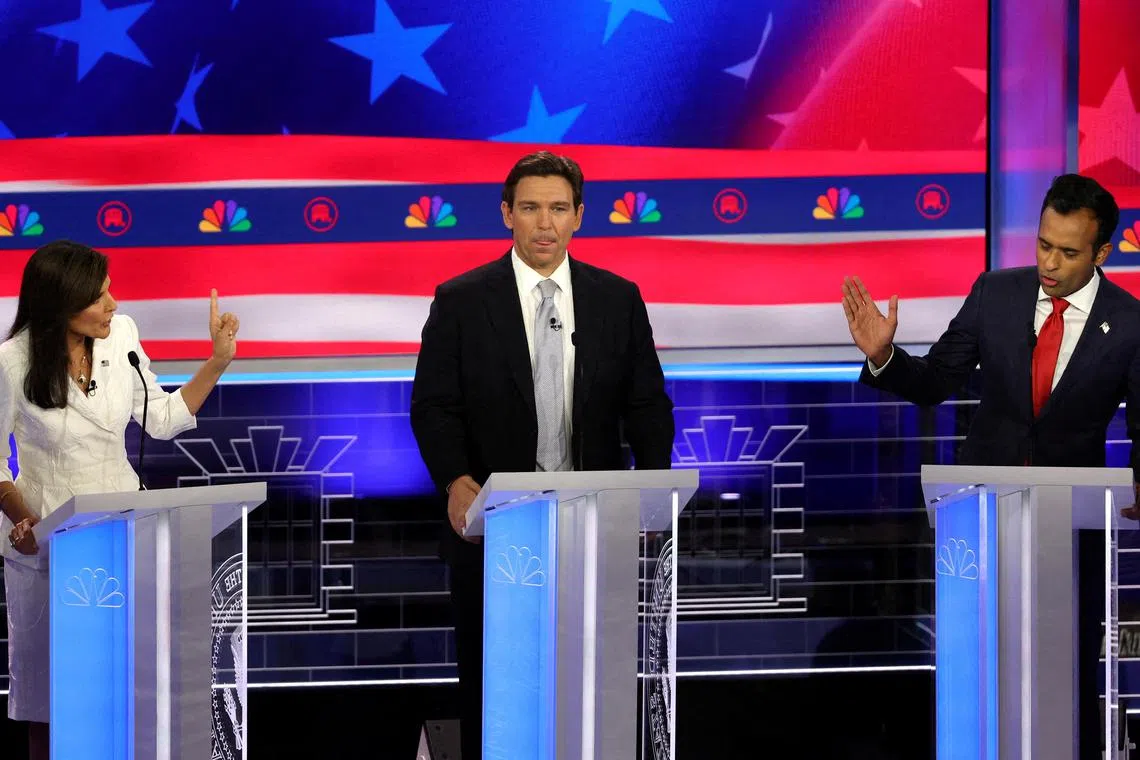 Florida Governor Ron DeSantis (centre) in the middle of a heated debate between fellow presidential candidates Nikki Haley (left) and Vivek Ramaswamy.