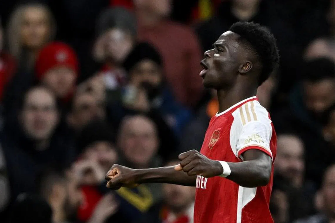FILE PHOTO: Soccer Football - Premier League - Arsenal v Liverpool - Emirates Stadium, London, Britain - February 4, 2024 Arsenal's Bukayo Saka celebrates scoring their first goal REUTERS/Tony Obrien/File Photo
