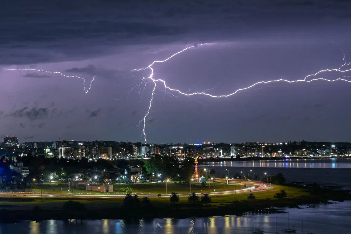 Lightning is seen during a thunderstorm over Montevideo, Uruguay on March 1, 2025.