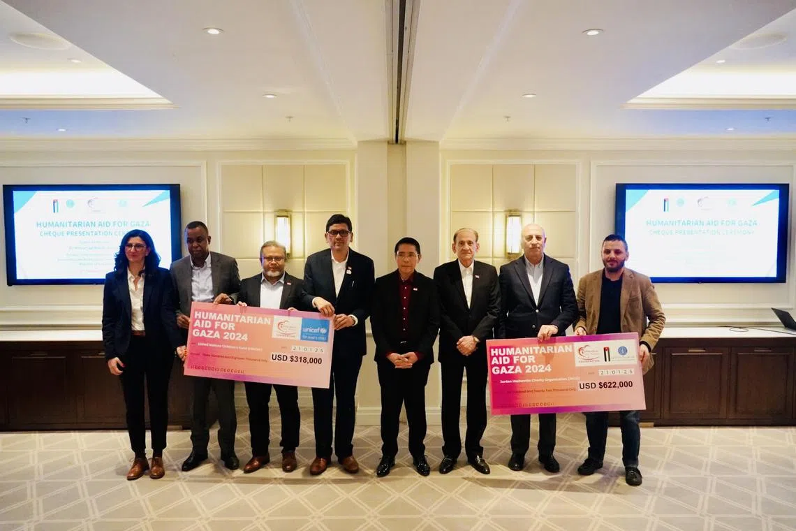 Singapore handing over its sixth tranche of humanitarian assistance for Gaza at a ceremony in Amman, Jordan, on Jan 21. From left to right: Ms Joana Perez Martorell, Regional Partnership and Resource Mobilisation Advisor of Unicef; Mr Abdul Fofana, Unicef Mena Deputy Regional Director of Operations; Rahmatan Lil Alamin Foundation (RLAF) Member of the Board of Trustees Zalman Putra Hamid Ali; RLAF CEO Adnan Hamid; Second Minister for Education and Foreign Affairs Dr Maliki Osman; Singapore Non-Resident Ambassador to Jordan Shamsher Zaman; Dr Hussein Al Shebli, Secretary-General of the Jordan Hashemite Charity Organisation (JHCO); and Mr Raad Awad, Director of Finance Department of the JHCO.
