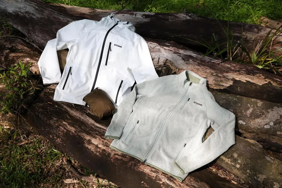 Goliath Outdoor’s Stormshield Ultralight jacket (left), which can be packed into a bag (centre), and their Core Comfort Fleece jacket (right).