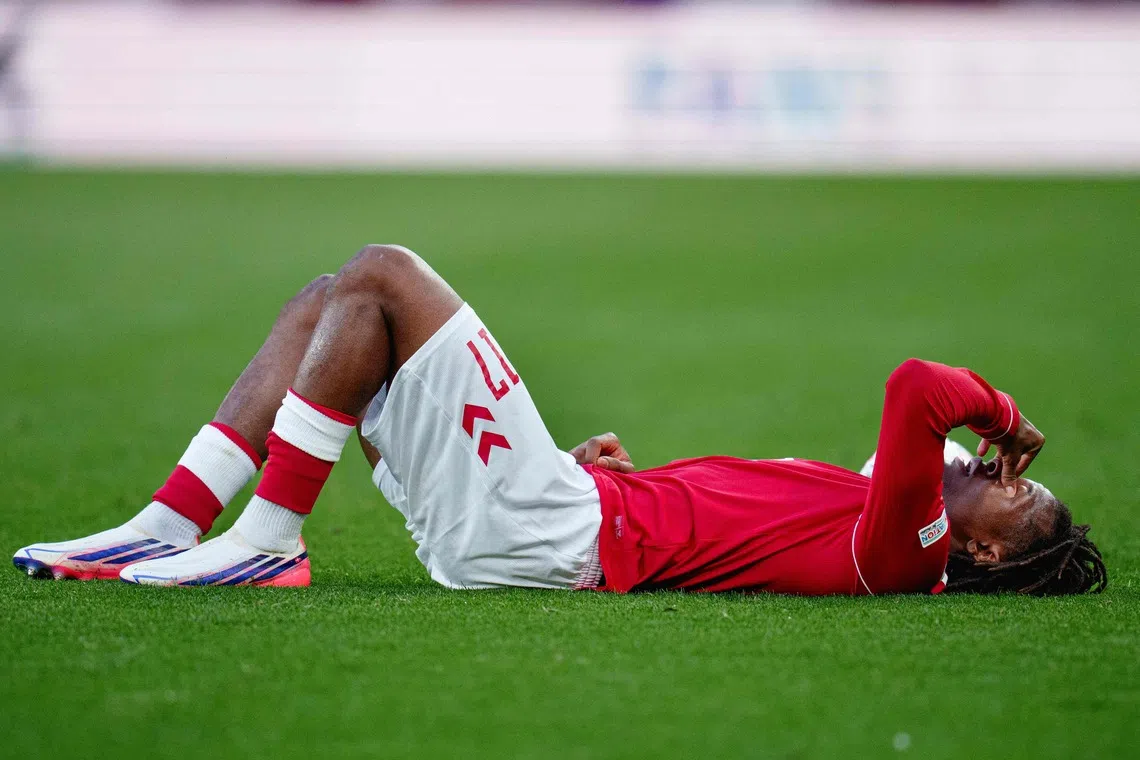 Manchester United’s Patrick Dorgu was forced off during the first half, appearing to hold the back of his thigh.