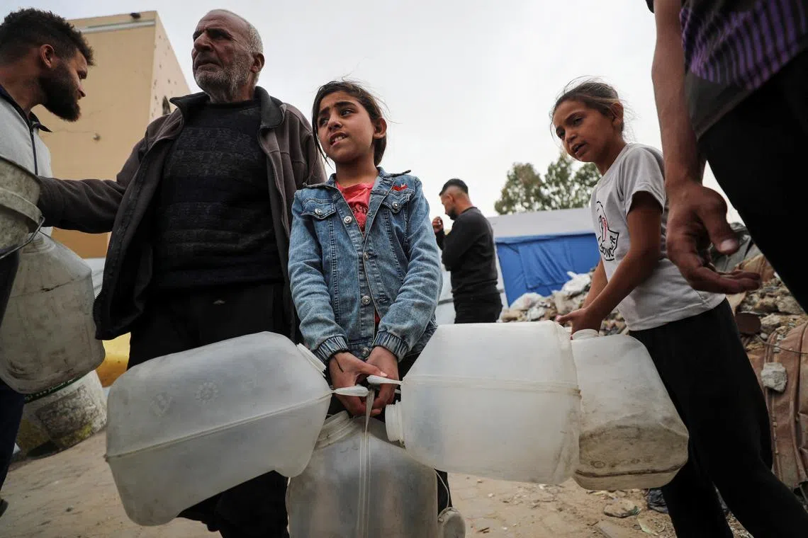 Many Gaza City residents now have to walk, sometimes for miles, to get a small water fill.