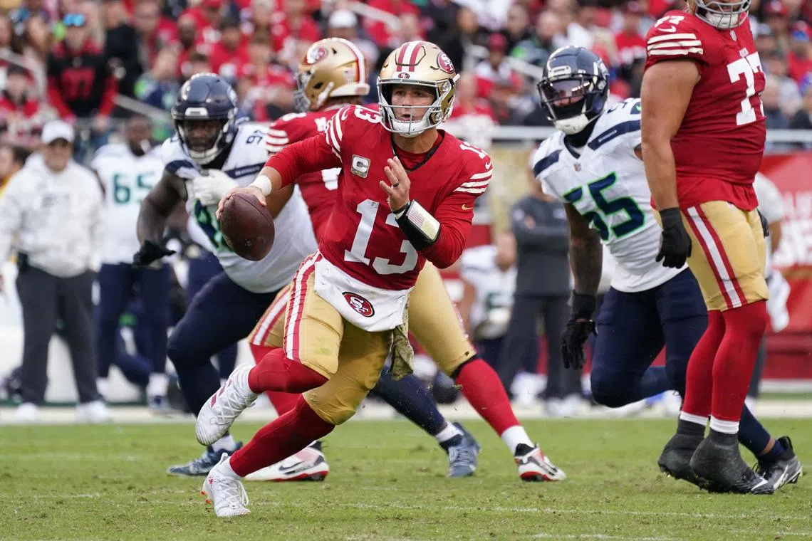 Nov 17, 2024; Santa Clara, California, USA; San Francisco 49ers quarterback Brock Purdy (13) scrambles away from Seattle Seahawks offensive tackle Michael Jerrell (65) in the third quarter at Levi's Stadium. Mandatory Credit: David Gonzales-Imagn Images/ File Photo