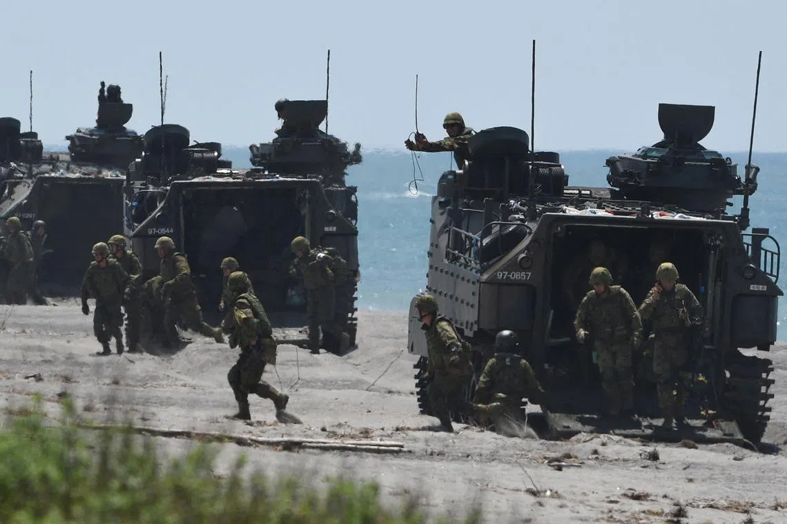 Japan Ground Self-Defense Forces participate in a joint exercise with Philippine and US troops in San Antonio, Zambales province, north of Manila on Oct 6.