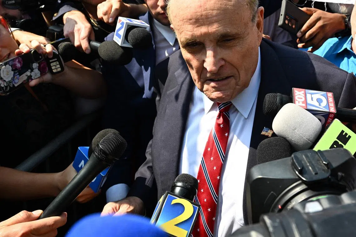 Former Trump attorney Rudy Giuliani filed for bankruptcy protection after he was ordered to pay US$148 million (S$200 million) to two Georgia election workers who he falsely accused of rigging votes in the 2020 presidential election. PHOTO: AFP