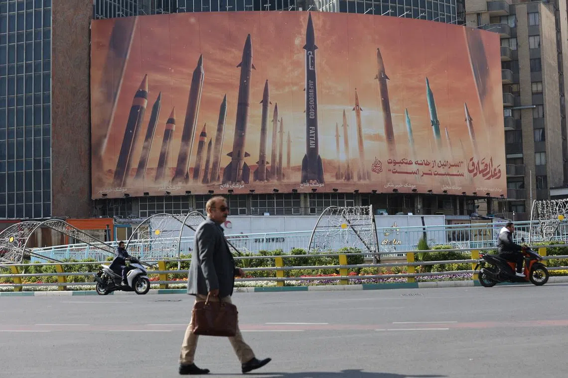 An anti-Israel billboard with a picture of Iranian missiles is seen in a street in Tehran, Iran April 15, 2024. Majid Asgaripour/WANA (West Asia News Agency) via REUTERS/File Photo
