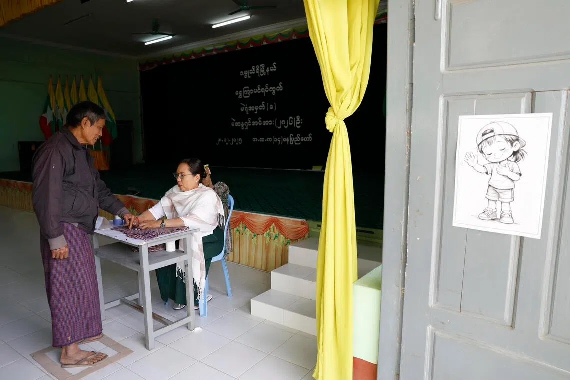 A voter at a polling station in Myanmar's Naypyitaw on Dec 28.