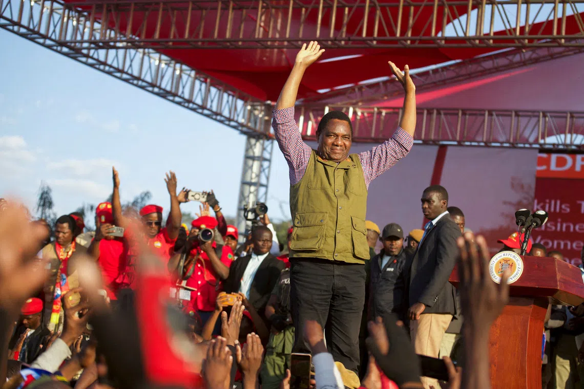 FILE PHOTO: Zambia's President Hakainde Hichilema greets United Party for National Development (UPND) supporters during their election campaign launch in Lusaka, Zambia, June 28, 2026. REUTERS/Moses Mwape/File Photo