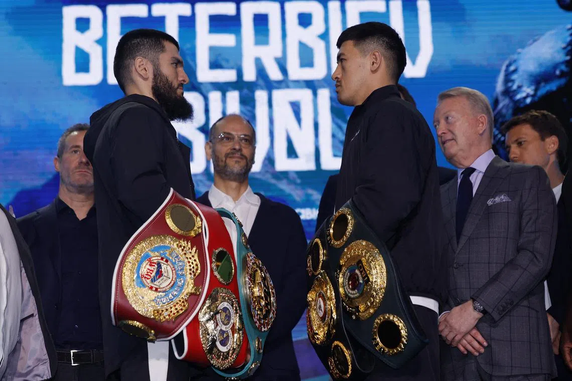 Artur Beterbiev (left) and Dmitry Bivol go head to head during the press conference in London in September. Beterbiev beat Bivol on a majority points decision in Saudi Arabia on Oct 13.