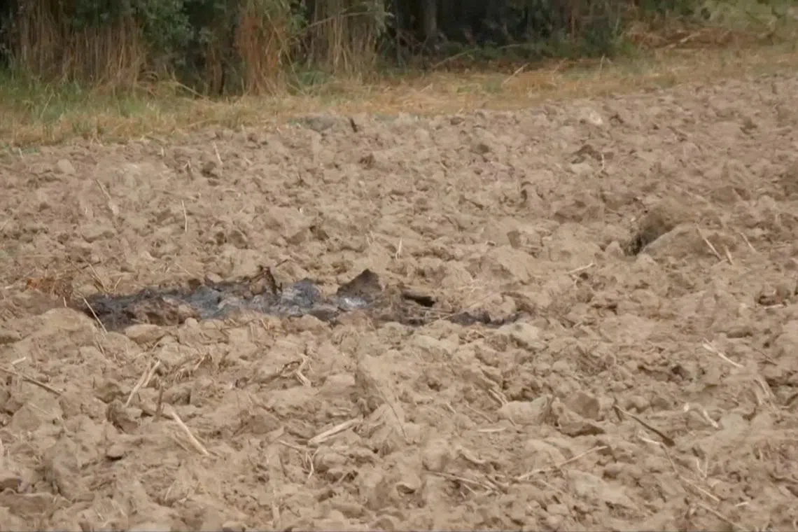 Parts of a damaged UAV shot down by Polish authorities lie at a site, after Russian drones violated Polish airspace during an attack on Ukraine, near Zamosc, Jaroslawiec region, Poland, September 10, 2025, in this screengrab obtained from a video. TVN via REUTERS