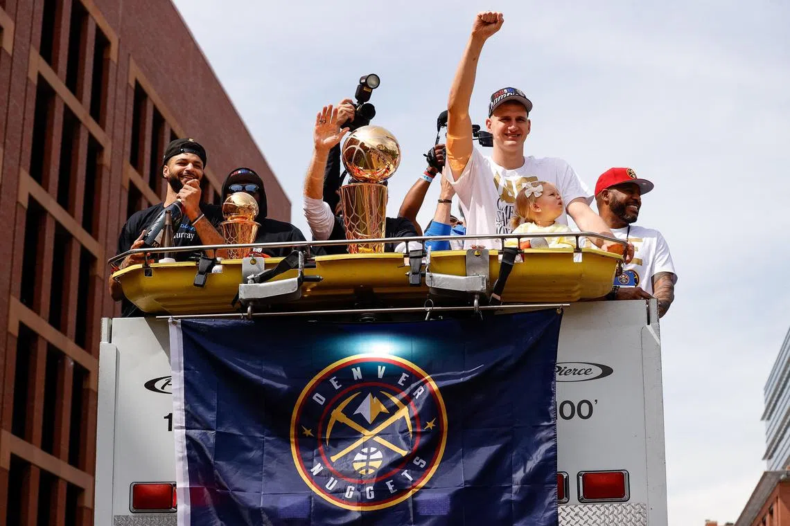 Jun 15, 2023; Denver, CO, USA; Denver Nuggets guard Jamal Murray (L) and center Nikola Jokic (R) during the championship parade after the Denver Nuggets won the 2023 NBA Finals. Mandatory Credit: Isaiah J. Downing-USA TODAY Sports