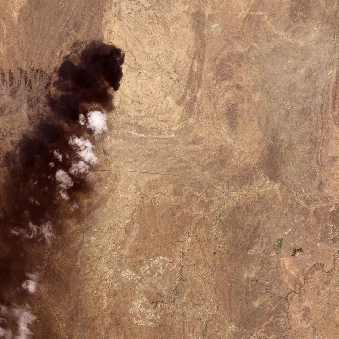 A satellite image of smoke billowing from an Aramco oil depot near the Saudi city of Abha after a Houthi attack on Sept 8.