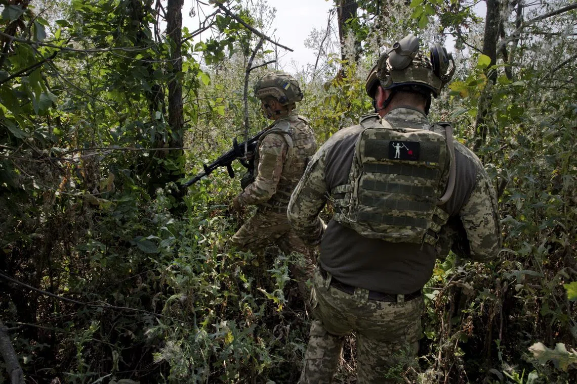 Ukrainian soldiers with the 35th Brigade outside the village of Makarivka, a former Russian position in the Zaporizhzhia region of southern Ukraine, on July 26, 2023. Recapturing the village of Staromaiorske was such welcome news for the country that President Volodymyr Zelensky announced it himself, but formidable Russian defenses have stymied progress elsewhere. (Tyler Hicks/The New York Times)
