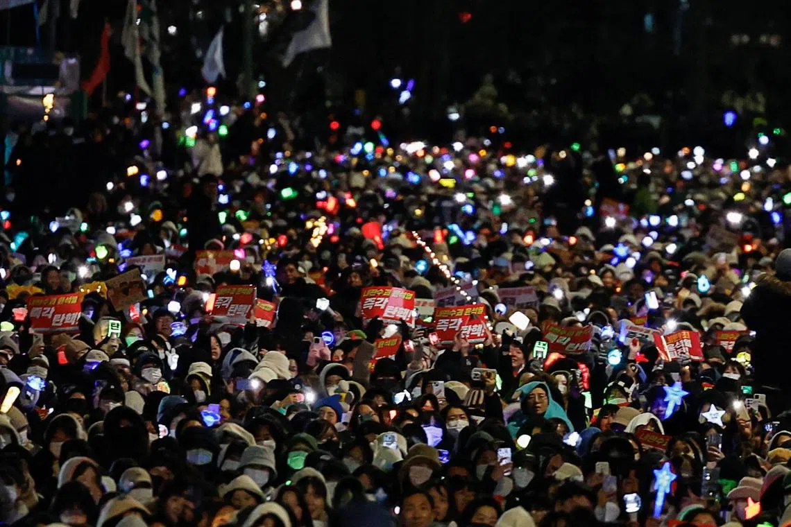 Protesters attend a rally calling for the impeachment of South Korean President Yoon Suk Yeol, near the National Assembly in Seoul, South Korea, on Dec 8, 2024.