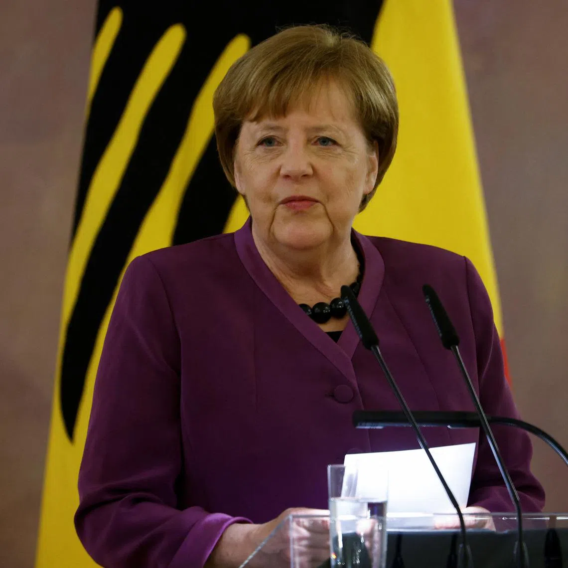 FILE PHOTO: Former Chancellor Angela Merkel, recipient of the country's highest Order of Merit or \"Grosskreuz des Verdienstordens der Bundesrepublik Deutschland in besonderer Ausfuehrung\", speaks during a Ceremony in Bellevue Palace in Berlin, Germany April 17, 2023. REUTERS/Michele Tantussi/File Photo