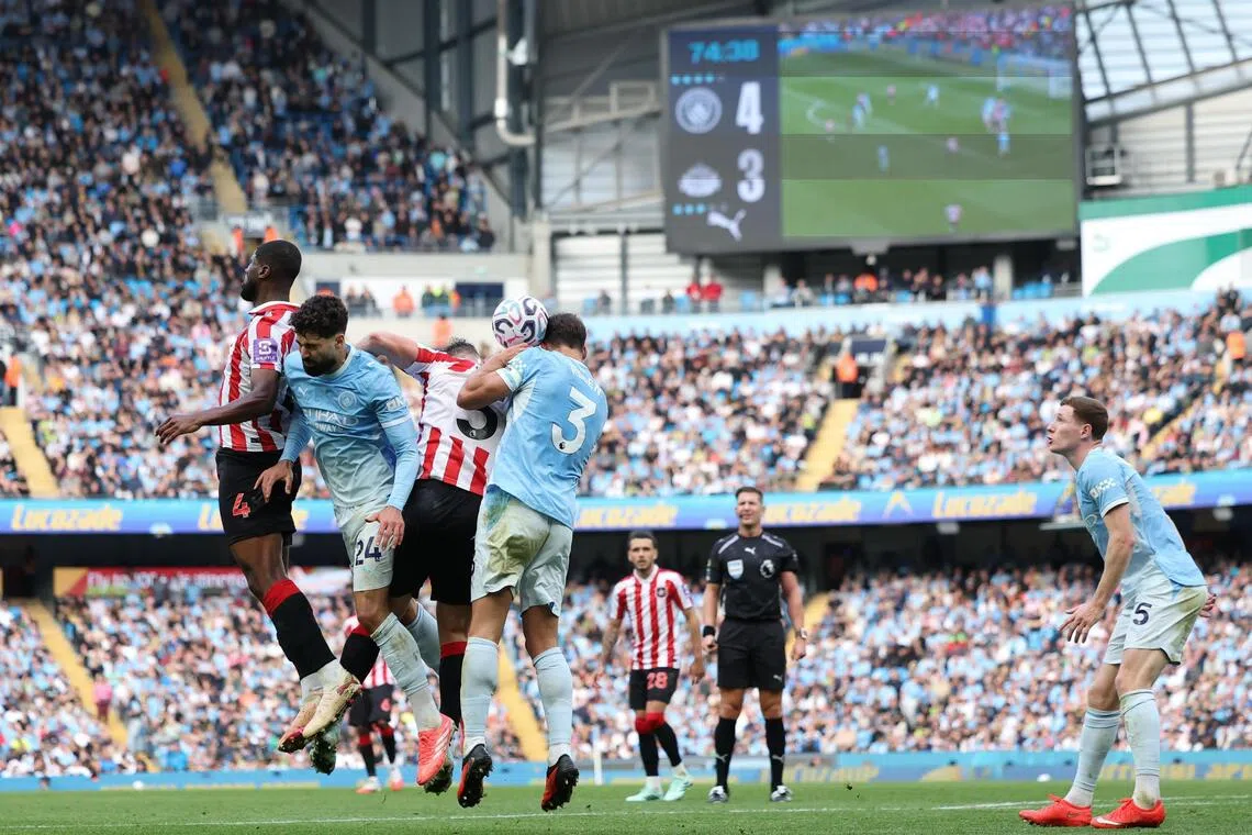 Manchester City (blue) in a 5-3 home win over Sunderland in their English Premier League match on Sept 20. They lead the standings with five straight wins this season but could face severe punishment for breaching financial rules, including points deduction and even relegation.