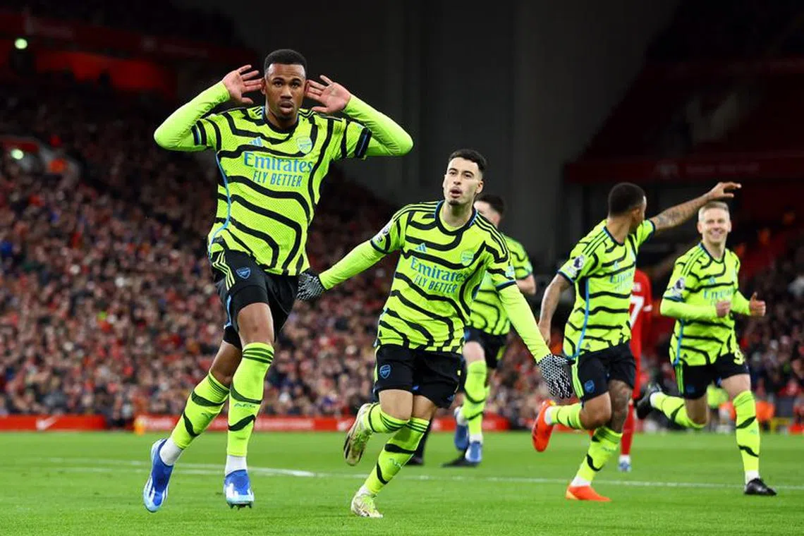 Soccer Football - Premier League - Liverpool v Arsenal - Anfield, Liverpool, Britain - December 23, 2023  Arsenal's Gabriel celebrates scoring their first goal with teammates REUTERS/Carl Recine/File Photo