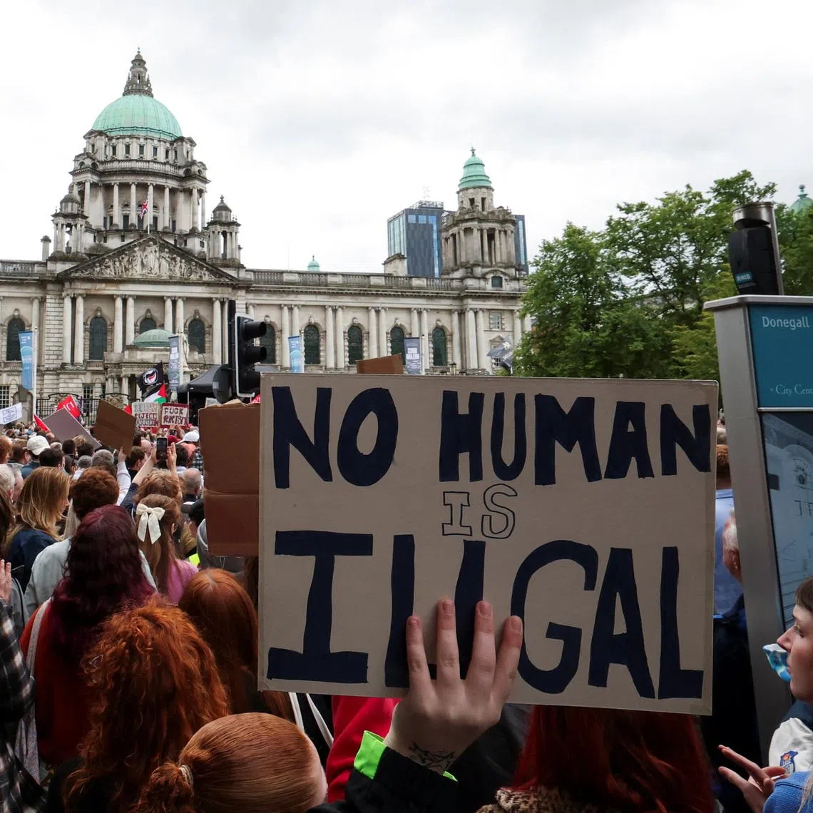 Demonstrators take part in a 'United Against Racism' rally after days of anti-immigration violence, following a knife attack on June 8, on June 13.