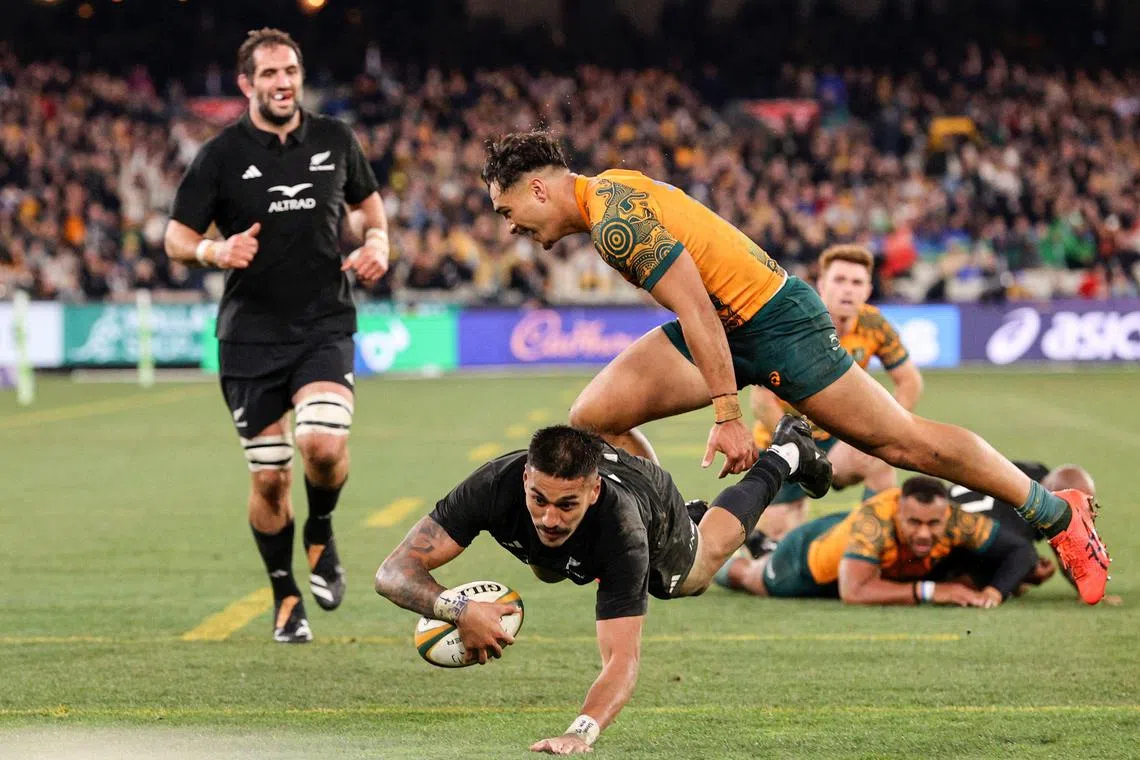 New Zealand's Rieko Ioane scores a try during the Rugby Championship and Bledisloe Cup match between Australia and New Zealand at Melbourne Cricket Ground.