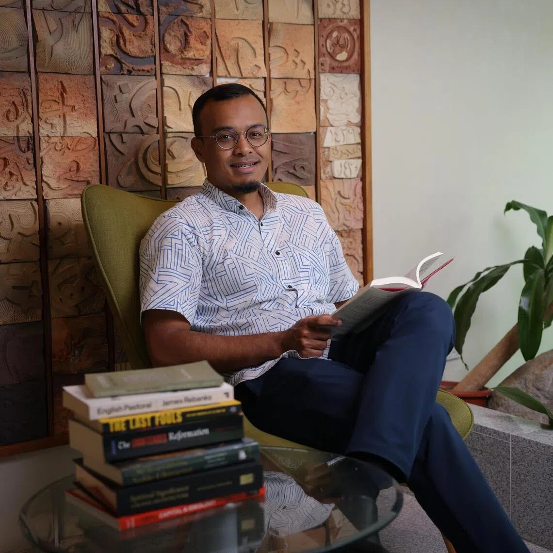 Mr Khairul Anwar, deputy chief executive of Muis, enjoys audiobooks on his drive. 