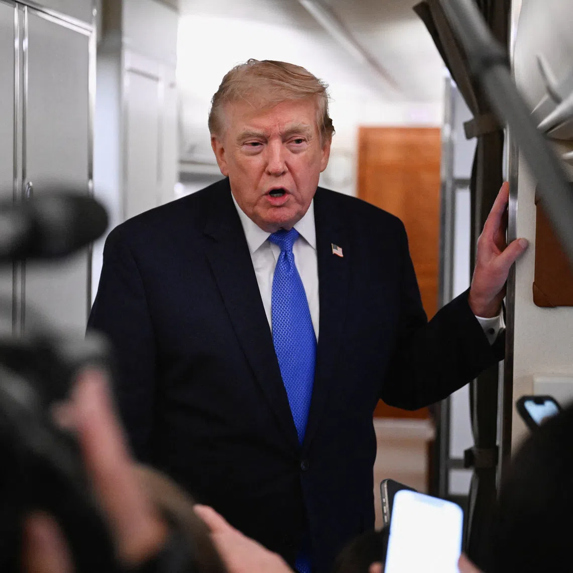 FILE PHOTO: U.S. President Donald Trump speaks to the media aboard Air Force One en route to Joint Base Andrews, in Maryland, U.S., August 2, 2026. REUTERS/Daniel Heuer/File Photo