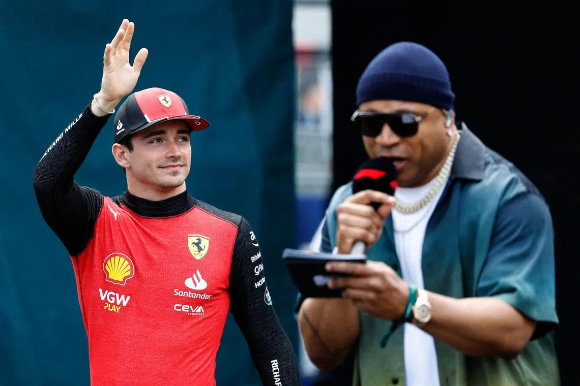 Charles Leclerc of Monaco and Ferrari walking to the grid as the drivers are introduced by LL Cool J before the Formula One Miami Grand Prix at Miami International Autodrome on Sunday.