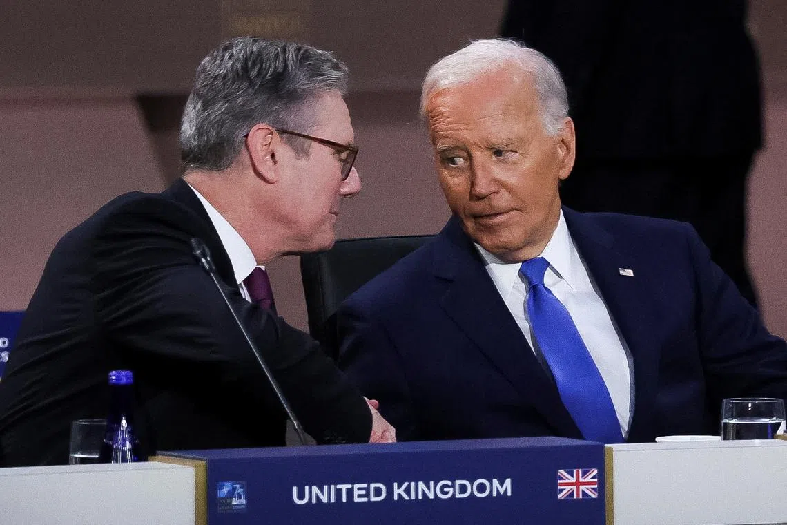 U.S. President Joe Biden looks at Britain's Prime Minister Keir Starmer at a meeting of the North Atlantic Council at the level of Heads of State and Government, Indo-Pacific and European Union during NATO's 75th anniversary summit in Washington, U.S., July 11, 2024. REUTERSLeah Millis
