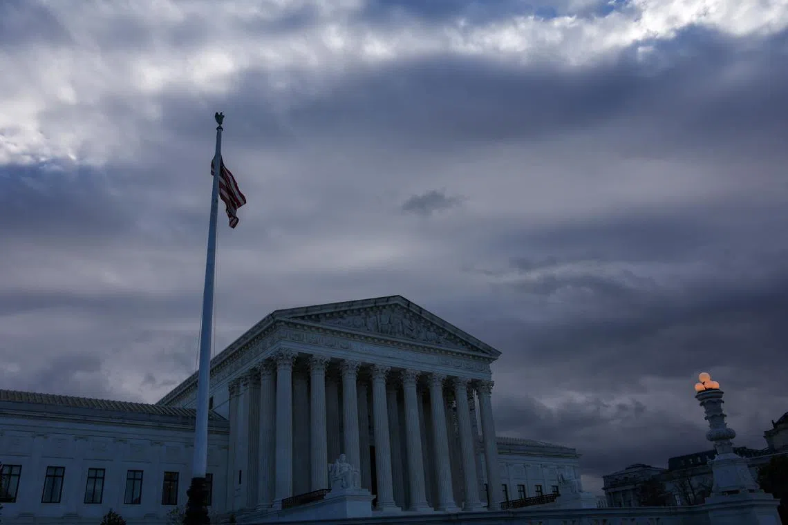 A U.S. Flag flutters outside of the United States Supreme Court Building, in Washington, U.S., December 5, 2024. REUTERS/Evelyn Hockstein/File Photo