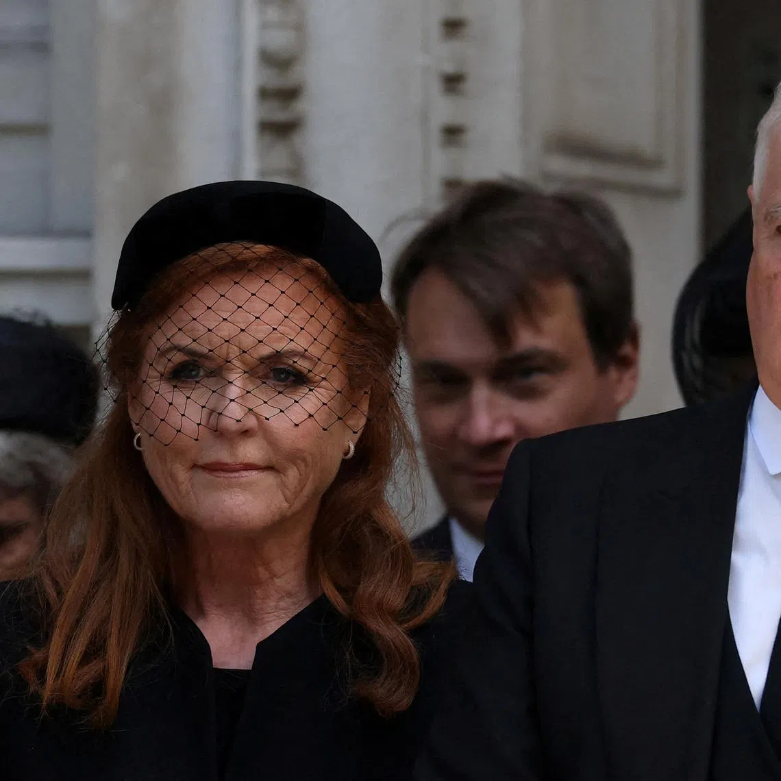 FILE PHOTO: Britain's Prince Andrew and his former wife, Sarah Ferguson, Duchess of York, leave Westminster Cathedral at the end of the Requiem Mass, on the day of the funeral of Britain's Katharine, Duchess of Kent, in London, Britain, September 16, 2025. REUTERS/Toby Melville/File Photo