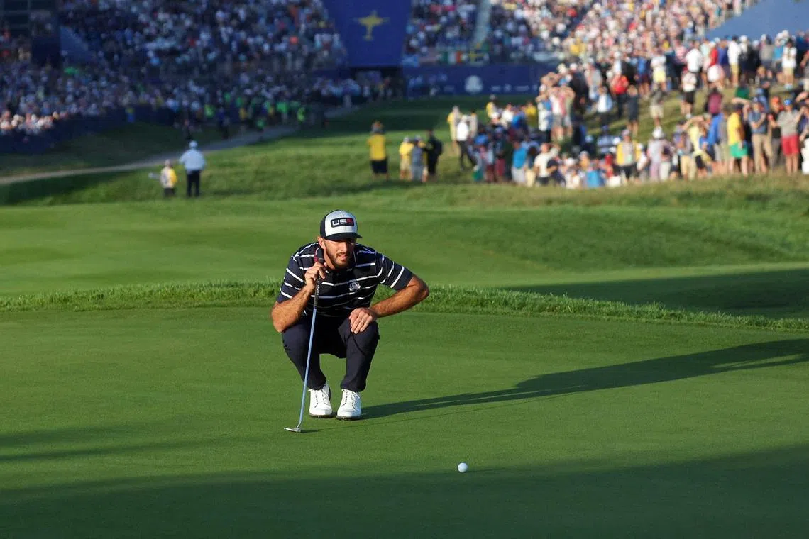 Team USA's Max Homa lines up his putt on the first green during the foursomes at the Ryder Cup.