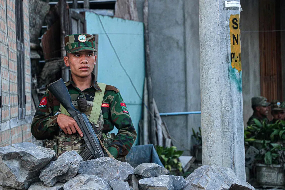 A sentry belonging to an ethnic armed group fighting Myanmar’s ruling junta guards a town in northern Shan state.
