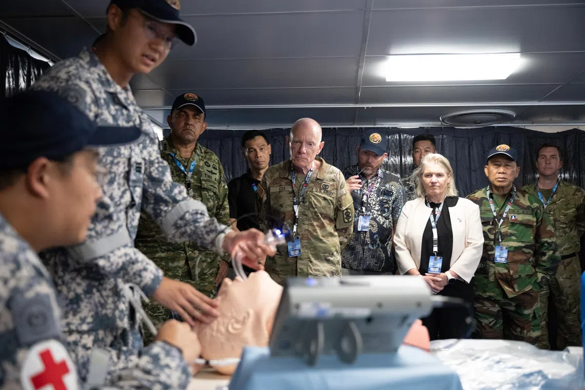 ADSOM-Plus Leaders and other VIPs observing a medical demonstration on board RSS Endeavour.