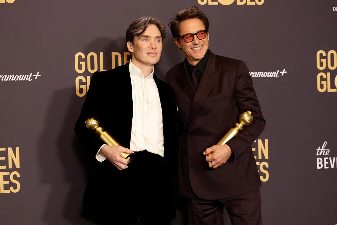 Cillian Murphy, winner of the award for Best Performance by a Male Actor in a Motion Picture for "Oppenheimer", and Robert Downey Jr., winner of the award for Best Performance by a Male Actor in a Supporting Role in any Motion Picture for "Oppenheimer", pose at the 81st Annual Golden Globe Awards in Beverly Hills, California, U.S., January 7, 2024. REUTERS/Mario Anzuoni