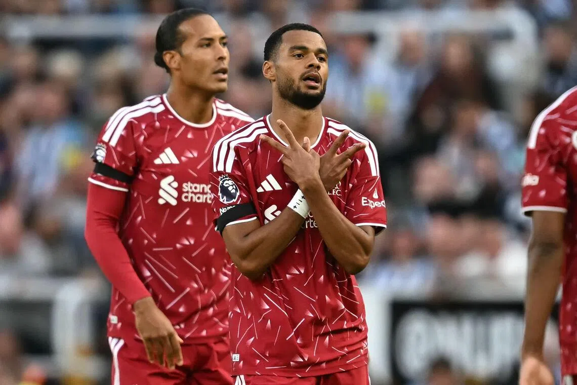 Liverpool’s Dutch forward Cody Gakpo (right) reacting to his goal in the 2-2 English Premier League draw with Newcastle United at St James’ Park on Aug 23 with teammate Virgil van Dijk behind him.