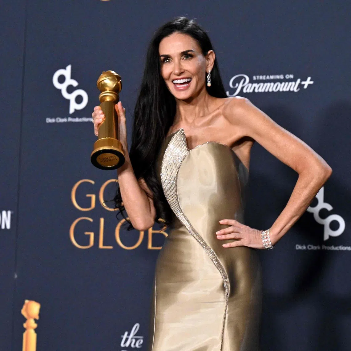 US actress Demi Moore poses with the Best Performance by a Female Actor in a Motion Picture – Musical or Comedy award for "The Substance" in the press room during the 82nd annual Golden Globe Awards at the Beverly Hilton hotel in Beverly Hills, California, on January 5, 2025. (Photo by Robyn Beck / AFP)
