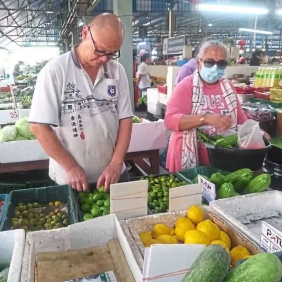 Vegetable seller Phua Ming Hui (left) said customers might have to bring their own bags or containers if sellers start reducing the use of plastic bags.