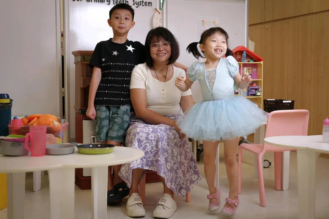 After her liver transplant in 2022, Elvia Lim, now five, is able to lead a normal life. She is seen here with brother Elvis,  eight, and mother Madam Felicia Tan, 36. 