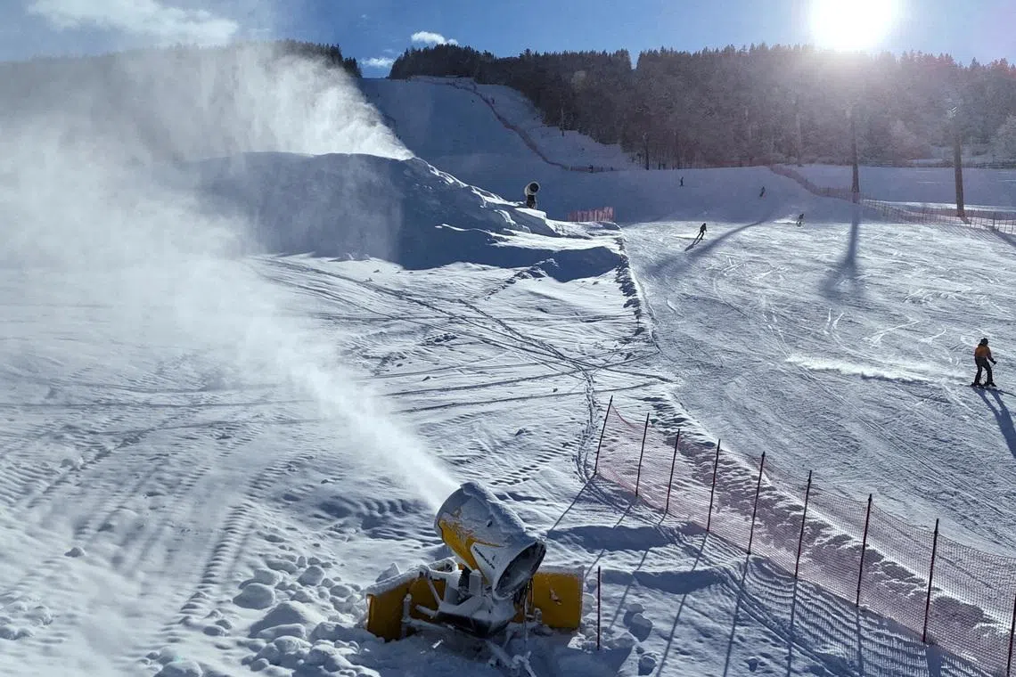 FILE PHOTO: TechnoAlpin snow cannons are pictured in action in Bormio, which will host the men's alpine skiing competition during the Milano Cortina Winter Olympic Games 2026, in Bormio, Italy, January 29, 2025. REUTERS/Claudia Greco/File Photo