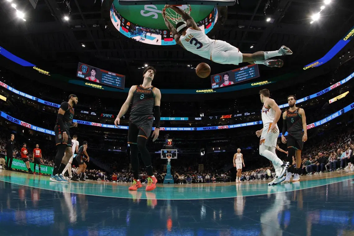 Phoenix Suns guard Bradley Beal dunking the ball as Washington Wizards forward Deni Avdija looks on in the second half at Capital One Arena on Feb 4. Beal had 43 points against his former team in the Suns' 140-112 road triumph.