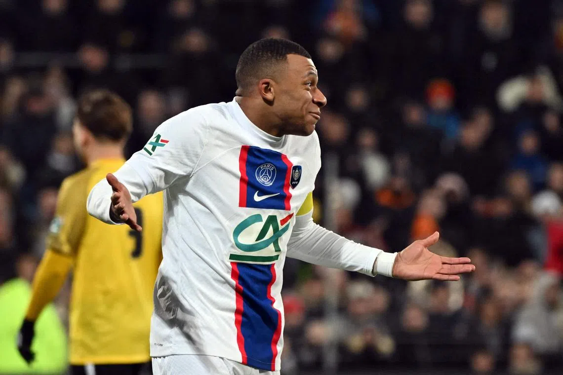Paris Saint-Germain's French forward Kylian Mbappe celebrates after scoring one of his five goals against sixth-tier US Pays de Cassel.