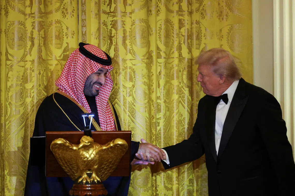 U.S. President Donald Trump greets Saudi Crown Prince and Prime Minister Mohammed bin Salman, during a dinner at the White House in Washington, D.C., U.S., November 18, 2025. REUTERS/Tom Brenner     TPX IMAGES OF THE DAY