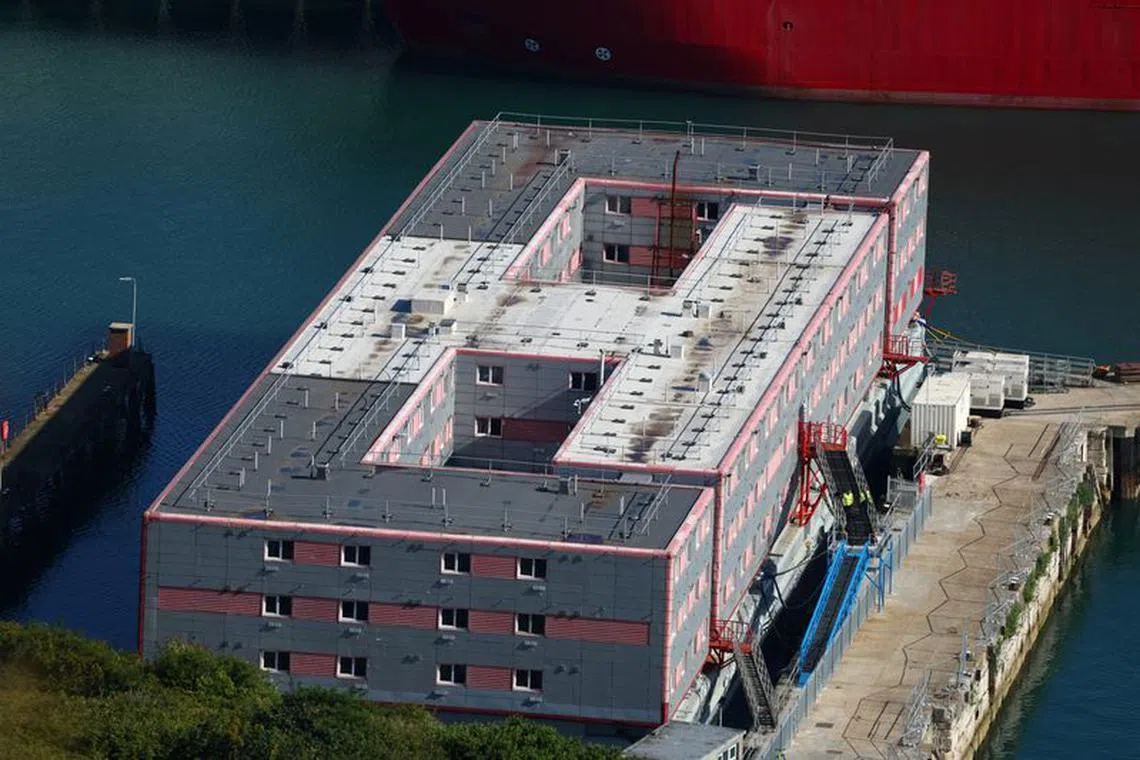 Some officials are aboard the Bibby Stockholm barge at Portland, near Poole, Britain, August 7, 2023. REUTERS/Toby Melville