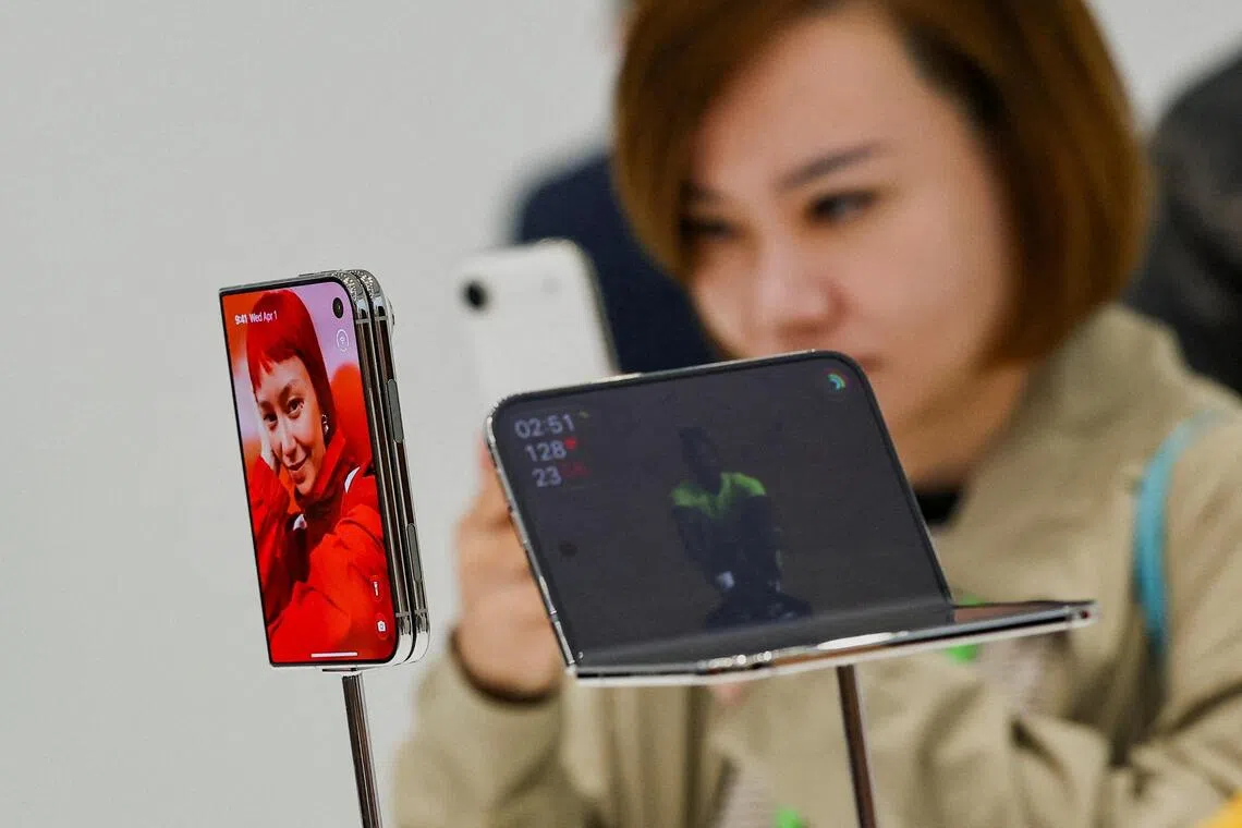 Apple’s new foldable iPhone Duo on display during the company’s event in Cupertino, California, on Sept 9.