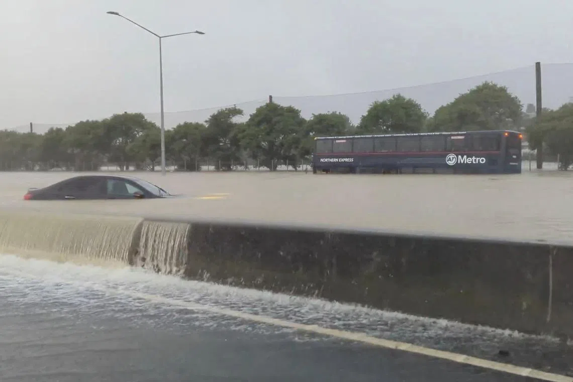 Stranded vehicles are seen during heavy rainfall in Auckland, New Zealand January 27, 2023, in this screen grab obtained from a social media video. @MonteChristoNZ/via REUTERS THIS IMAGE HAS BEEN SUPPLIED BY A THIRD PARTY. MANDATORY CREDIT. NO RESALES. NO ARCHIVES.