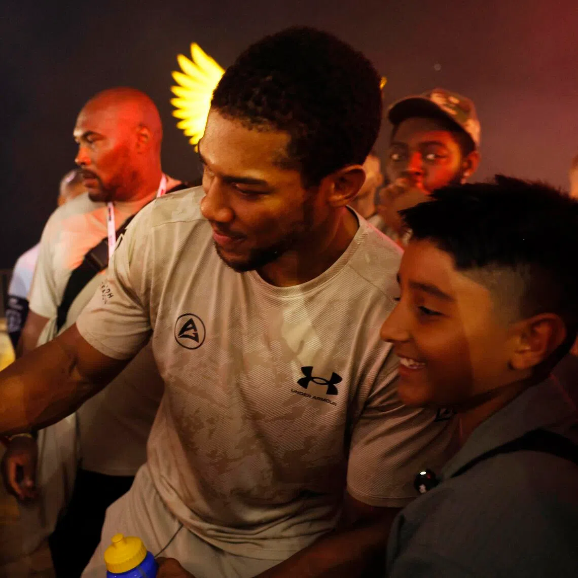 British boxer Anthony Joshua taking a wefie with a fan on July 23, ahead of his bout against Albania’s Kristian Prenga on July 25.